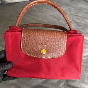 Longchamp folded but expandable tote